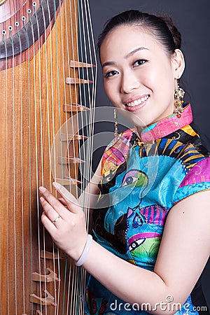 Young women and Chinese zither Stock Photo