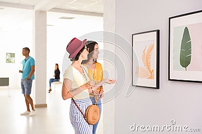 Young women at exhibition Stock Photo