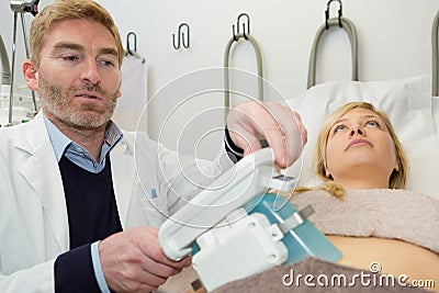 Young woman having cool sculpting therapy Stock Photo