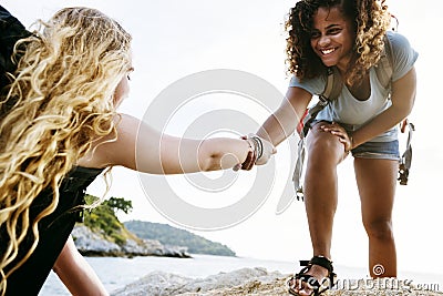 Young women helping each other Stock Photo