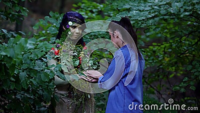 Young woman meeting mother earth in forest, nature unity, safe environment Stock Photo