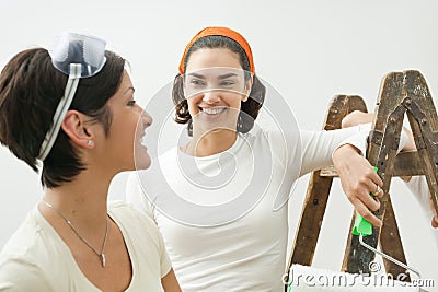 Young women painting home Stock Photo