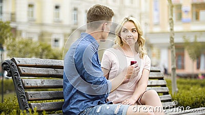 Young woman rejecting boyfriends proposal, disappointed with engagement ring Stock Photo