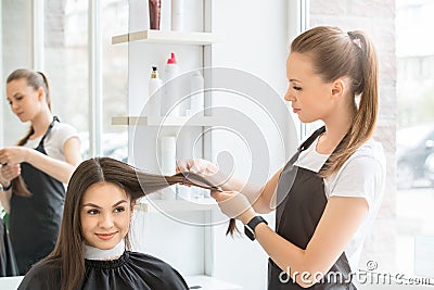 Young women sitting in beauty hair salon style Stock Photo