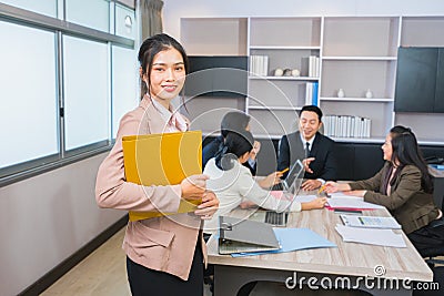 young women smart standing in front of manager and staff meeting Stock Photo