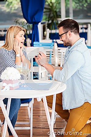 Surprised and very happy young woman after being proposed by her boyfriend Stock Photo