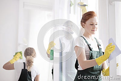 Woman cleaning window frame Stock Photo