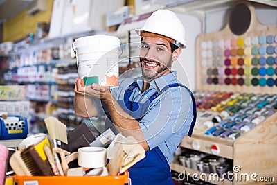 Young workman choosing materials Stock Photo