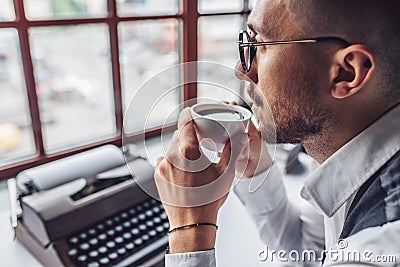 Young writer with a cup of coffee Stock Photo