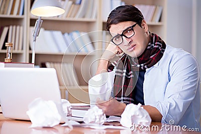The young writer working in the library Stock Photo