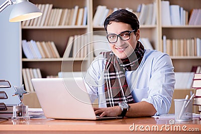 The young writer working in the library Stock Photo
