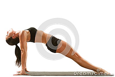Young yoga female doing yogatic exercise Stock Photo