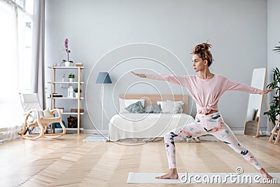 Young yogi woman practicing yoga pose, working out home Stock Photo