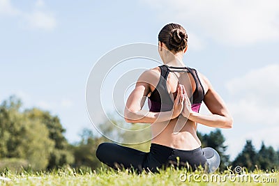 young yogini in Reverse Prayer Pose practicing Stock Photo