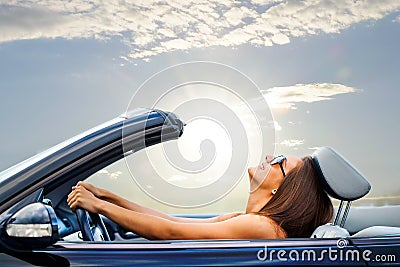Young girl driving convertible Stock Photo