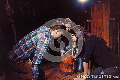 Younth looking in the bucket in search of conundrum solution to Stock Photo