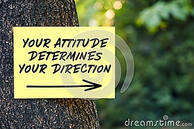 Your attitude determines your direction message written on paper on a tree. Inspirational or motivational quote Stock Photo