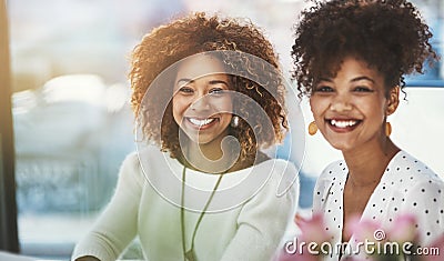 Your attitude determines your direction. two designers at the office. Stock Photo