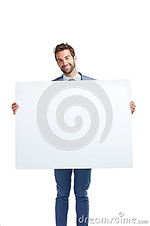 Your brand endorsed with corporate charm. Studio shot of a handsome businessman holding up a blank placard against a Stock Photo