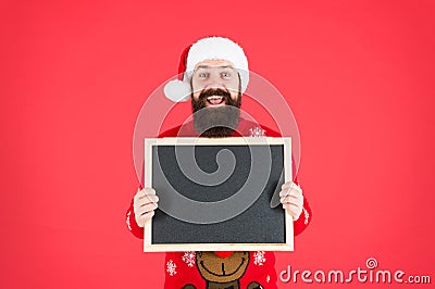 For your New Year greetings. Santa welcomes you to New Year eve party. Bearded man hold empty blackboard. Merry Stock Photo