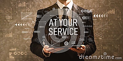 At your service with businessman holding a tablet computer Stock Photo