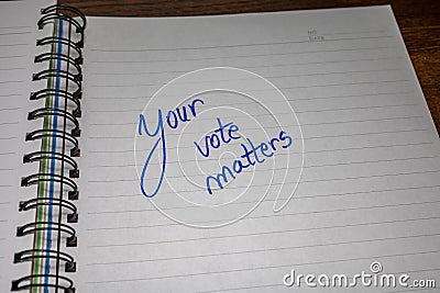 Your vote matters, handwriting text on paper, political message. Political text on office agenda. Concept of democracy, voting, Stock Photo