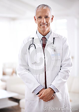 Your wellness is my priority. Portrait of a mature medical doctor smiling at the camera. Stock Photo