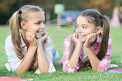 Youre awesome just like me. Happy children relax on green grass. Beauty look of small children. Little children enjoy Stock Photo