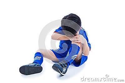 Youth asian soccer player crying for a painful knee injury. Full Stock Photo