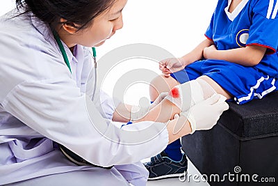 Youth asian sport boy in blue uniform. Knee joint pain. Stock Photo