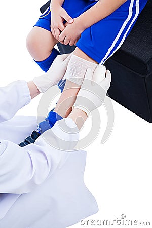 Youth asian sport boy in blue uniform. Knee joint pain. Stock Photo