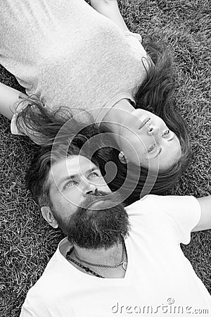 Youth and freedom. Couple in love relaxing lay meadow. Freshness and peace. Hipster bearded man and girl happy carefree Stock Photo