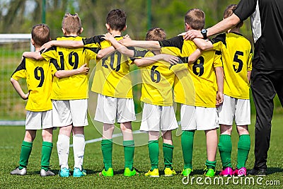 Youth sports team. Young players standing together with coach Editorial Stock Photo