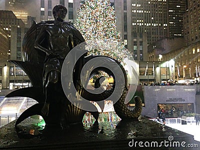 Youth Statue in front of Rockefeller Center after Rain in December. Editorial Stock Photo