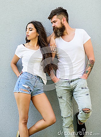 Youth stylish outfit. Feel their style. Couple white shirts cuddle each other. Hipster bearded and stylish girl hang out Stock Photo