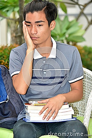 A Youthful Asian Student And Sadness Stock Photo