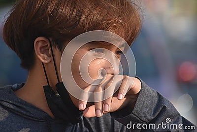 Youthful Filipino Male Coughing Wearing Facemask Stock Photo