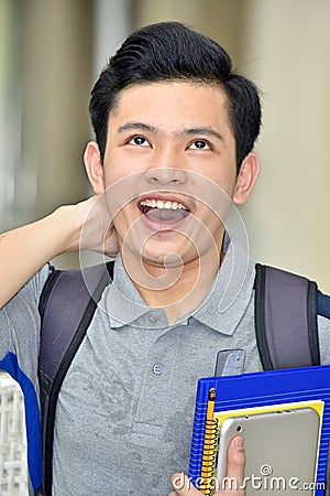 Youthful Filipino Male Student Laughing Stock Photo