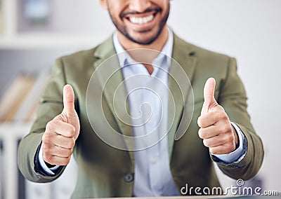 Youve been endorsed by the best. an unrecognizable businessman giving thumbs up while sitting in his office. Stock Photo