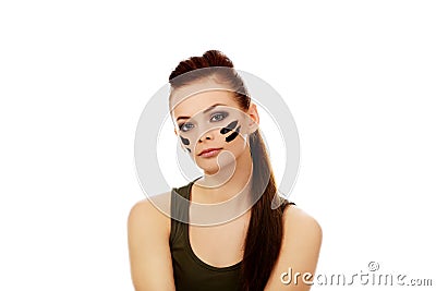 Ypung beautiful soldier woman sitting on the floor Stock Photo