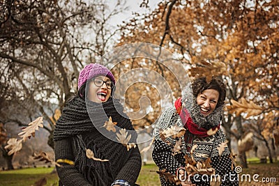 Ypung women having fun and laughing in the park. Stock Photo