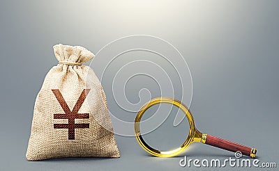 Yuan Yen money bag and magnifying glass. Find high-paying job. Most favorable conditions for deposits, loans. Financial audit. Stock Photo