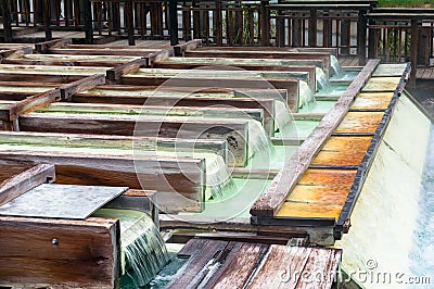 Yubatake hot spring wooden boxes with mineral water Stock Photo