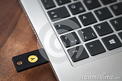 YubiKey hardware authentication device for telecommuting Editorial Stock Photo