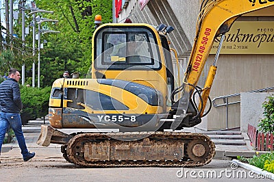 YUCHAI YC55-8 Excavator. Road Maintenance Works in Russia. Editorial Stock Photo