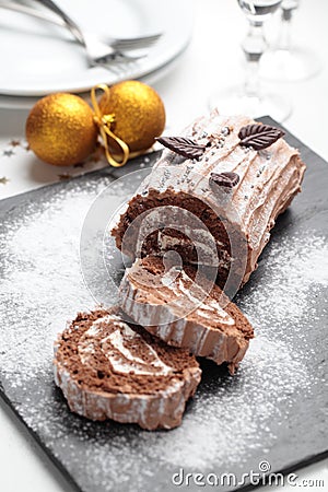 Yule log cake on a Christmas table Stock Photo