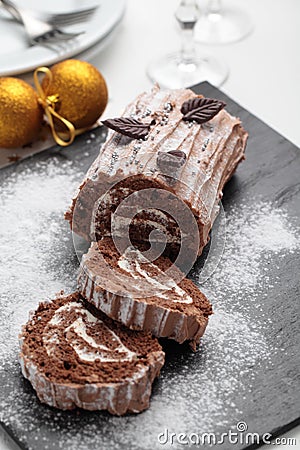 Yule log cake on a Christmas table Stock Photo