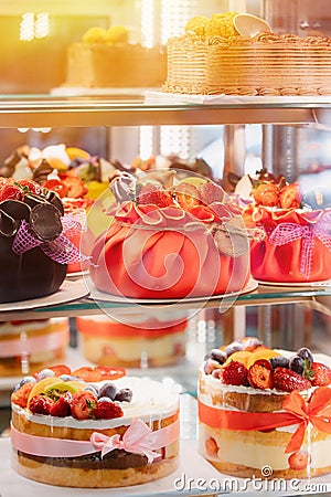 yummy assortment baked pastry in bakery. Various Different Types Of Sweet Cakes In Pastry Shop Glass Display. Good Stock Photo