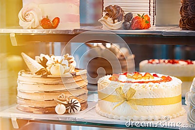 yummy assortment baked pastry in bakery. Various Different Types Of Sweet Cakes In Pastry Shop Glass Display. Good Stock Photo