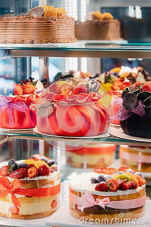 yummy assortment baked pastry in bakery. Various Different Types Of Sweet Cakes In Pastry Shop Glass Display. Good Stock Photo